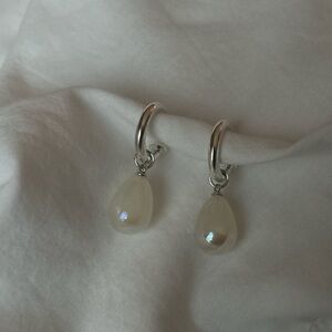 Silver hoops with pearl accents